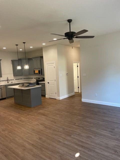 7326 Mountain View Road, Unit 7328 Abilene, TX 79602 - Photo 4 of 15 a view of kitchen with stainless steel appliances kitchen island wooden floors wooden cabinets and entryway