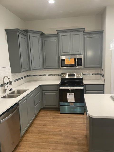 7326 Mountain View Road, Unit 7328 Abilene, TX 79602 - Photo 7 of 15 a kitchen with stainless steel appliances granite countertop a sink and stove top oven