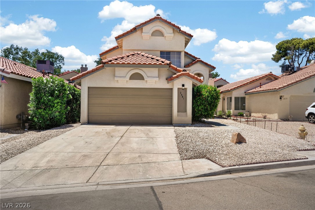 2681 Rungsted Street Las Vegas, NV 89142 - Photo 1 of 33 A well-maintained stucco facade with a red tile roof creates inviting curb appeal.
