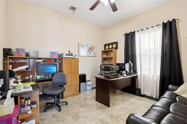 a room with furniture and musical instruments