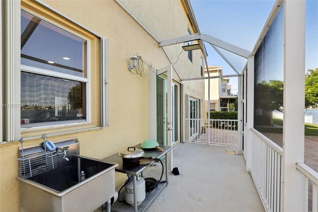 a view of a balcony with chair and table in the balcony