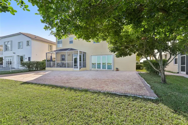 a view of a swimming pool with an outdoor space and seating area