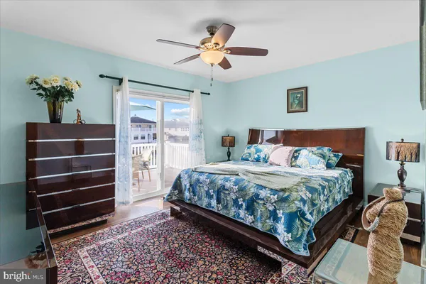 a dining room with furniture water view and a floor to ceiling window