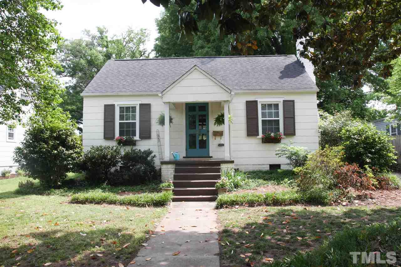 726 Kimbrough Street Raleigh, NC 27608 - Photo 1 of 18 a view of a house with a yard plants and large tree