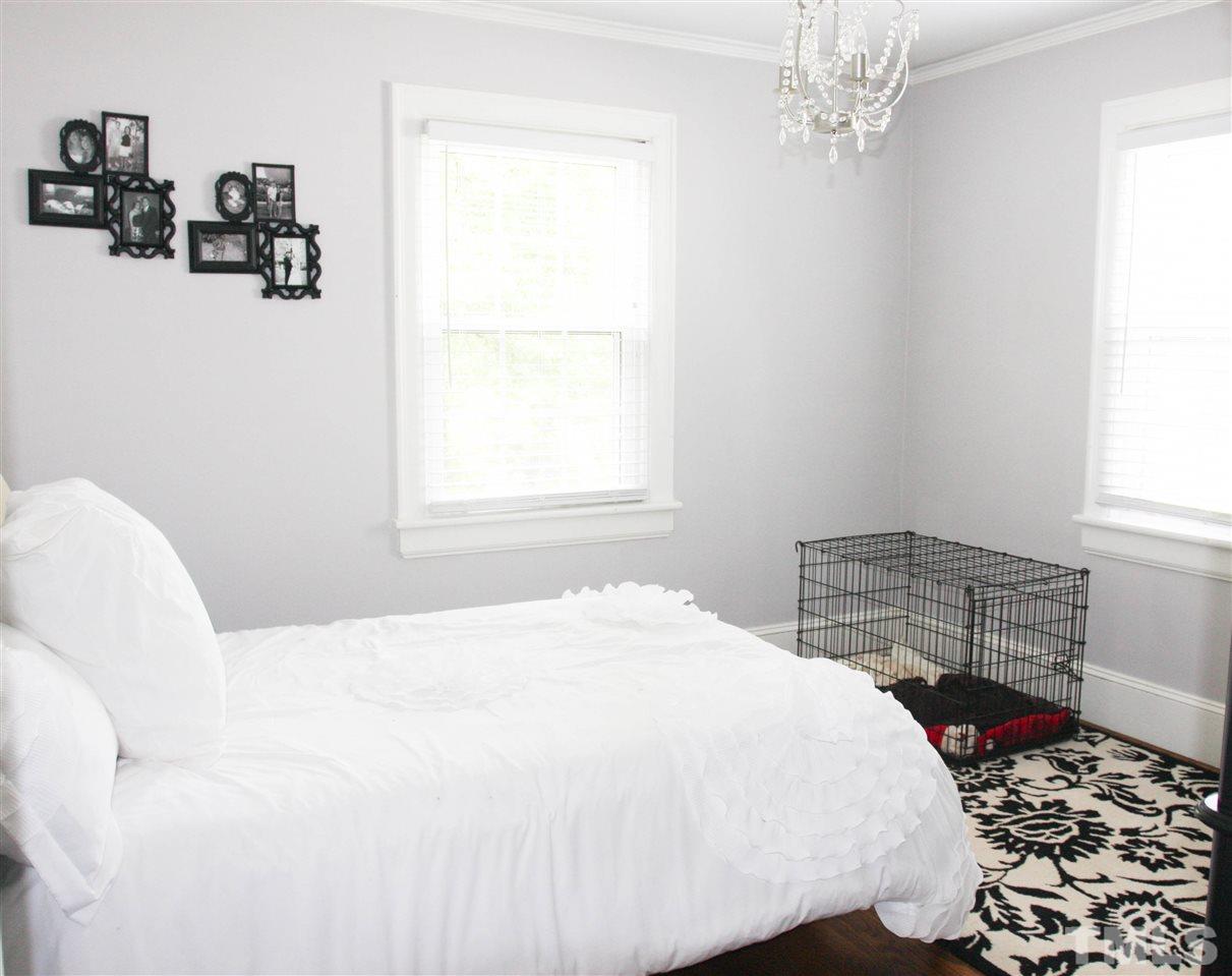 726 Kimbrough Street Raleigh, NC 27608 - Photo 14 of 18 a bedroom with a bed and a window