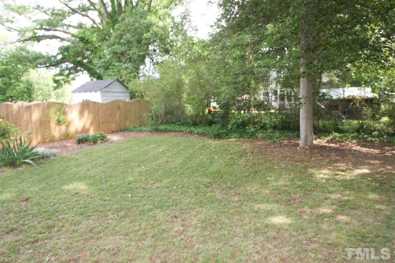 726 Kimbrough Street Raleigh, NC 27608 - Photo 17 of 18 a view of a field with a tree