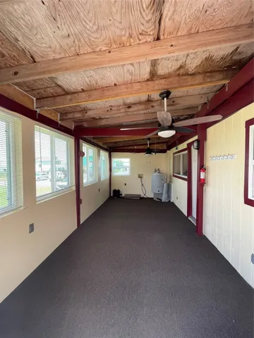 a view of a room with wooden walls