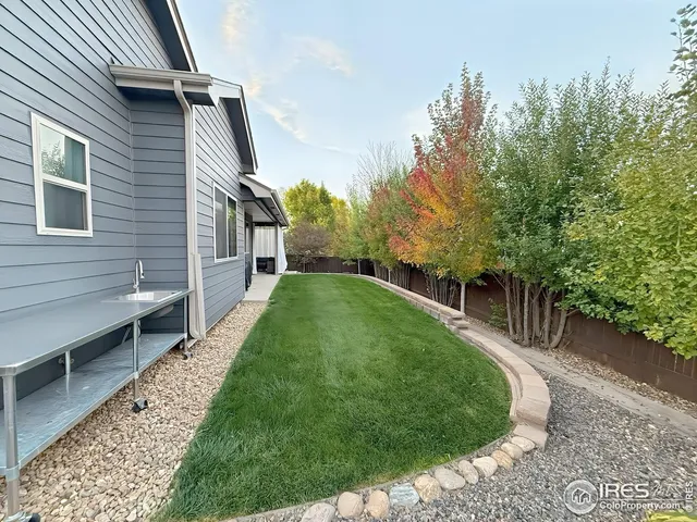 a backyard of a house with lots of green space