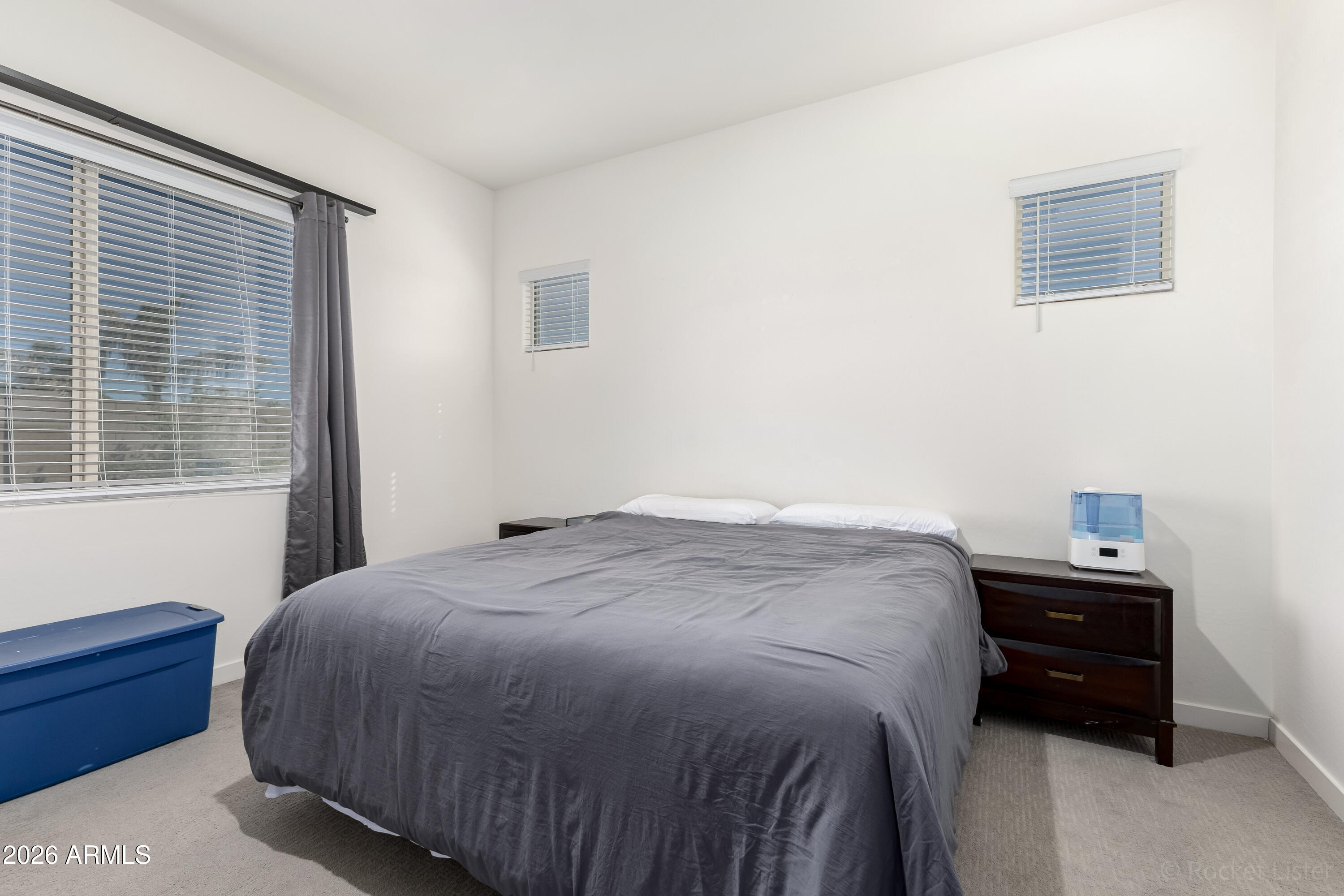 23929 North 166th Lane Surprise, AZ 85387 - Photo 10 of 23 a bedroom with a bed and a window