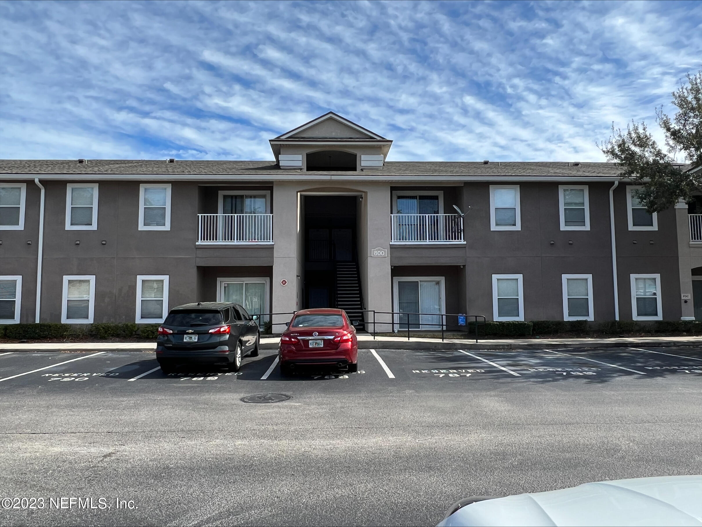7920 Merrill Road, Unit 803 Jacksonville, FL 32277 - Photo 12 of 12 a car parked in front of a building