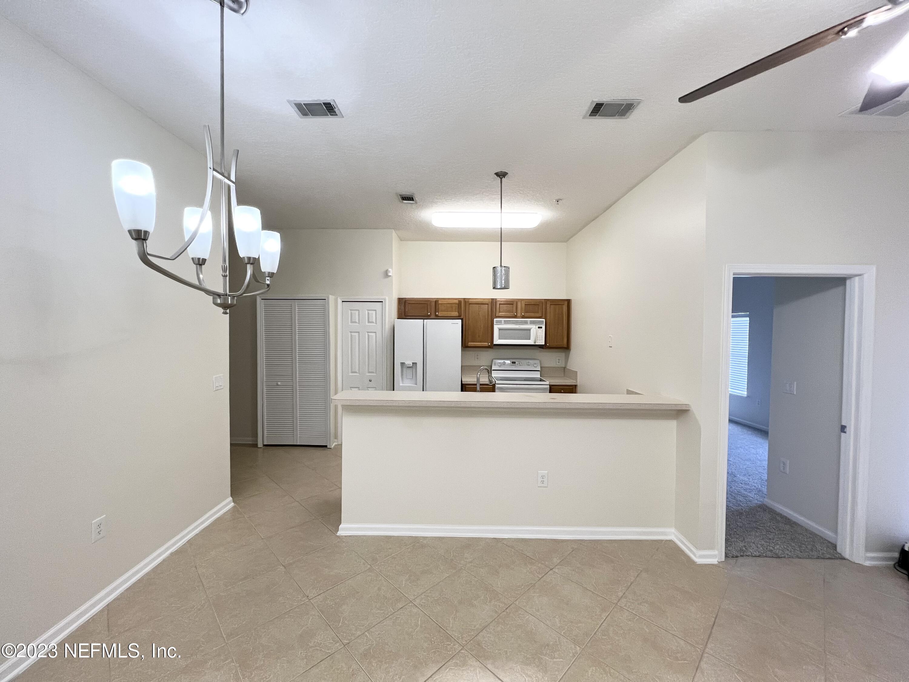 7920 Merrill Road, Unit 803 Jacksonville, FL 32277 - Photo 3 of 12 a view of kitchen and sink