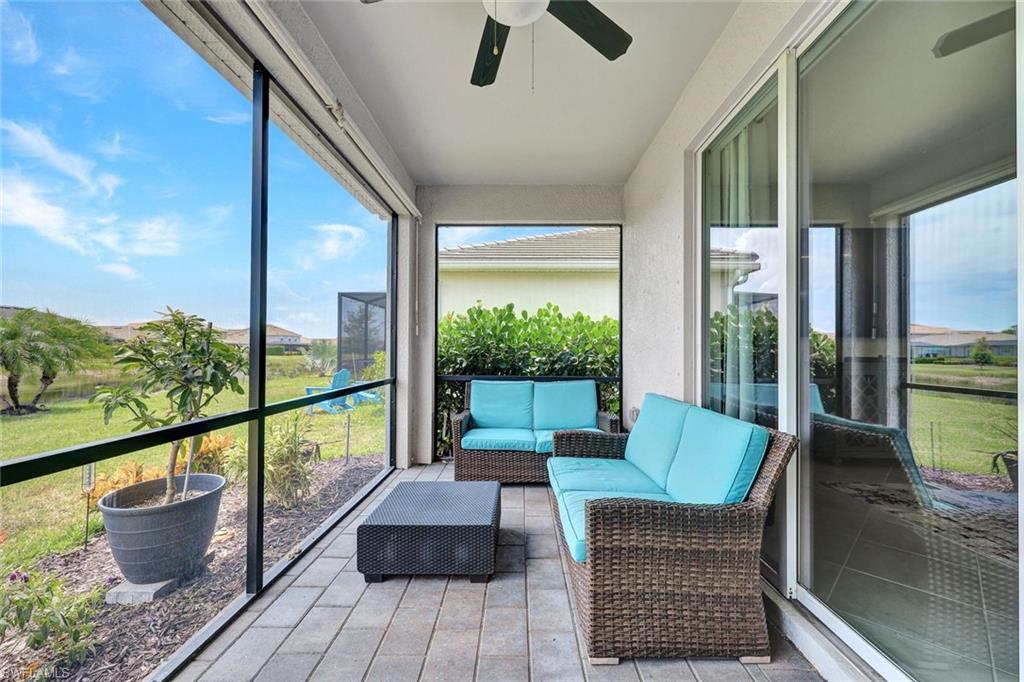 2622 Scarlet Way Naples, FL 34120 - Photo 16 of 24 a balcony with furniture and a potted plant