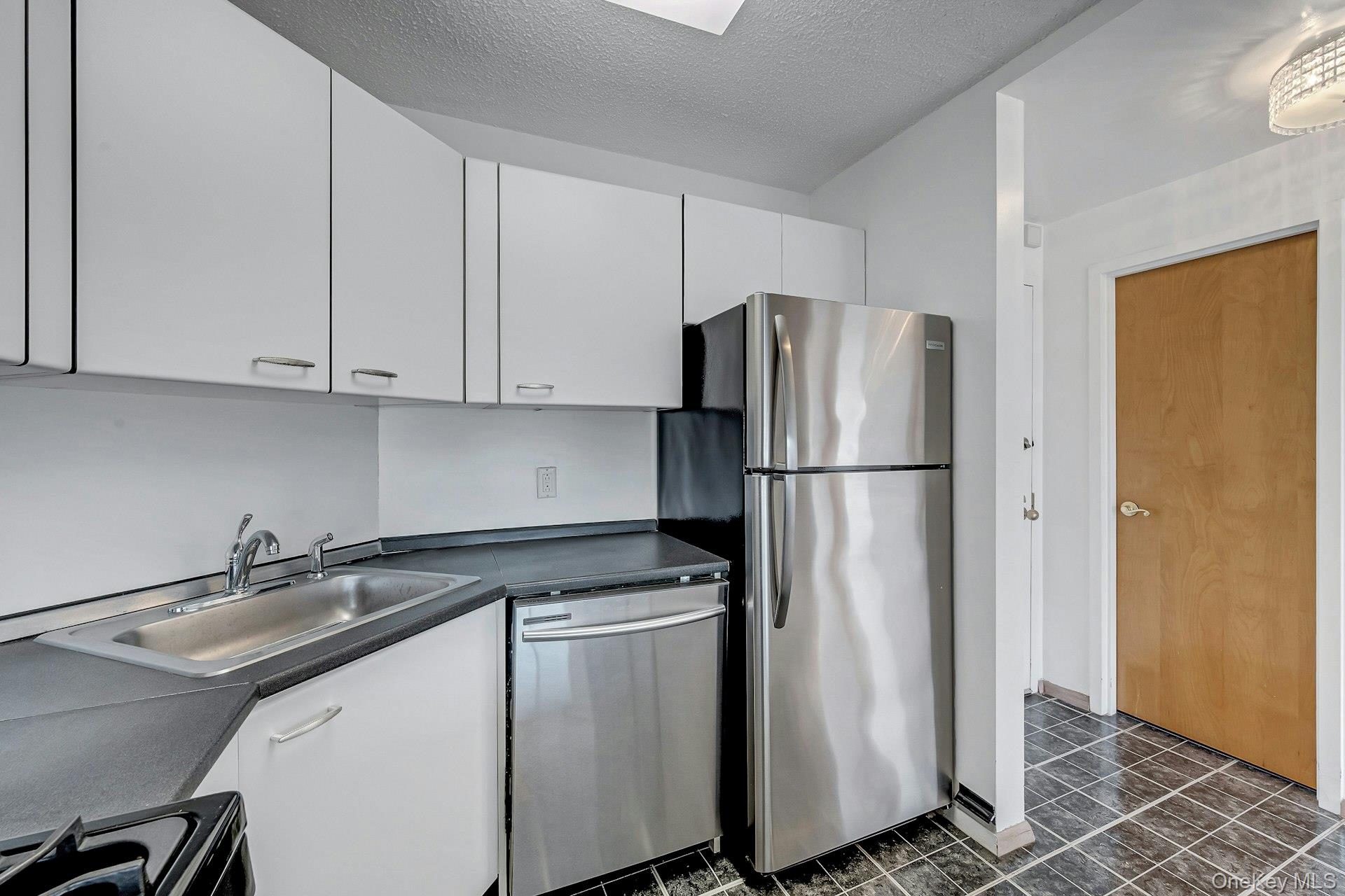 703 Pelham Road, Unit 412 New Rochelle, NY 10805 - Photo 12 of 26 Kitchen view toward entry.