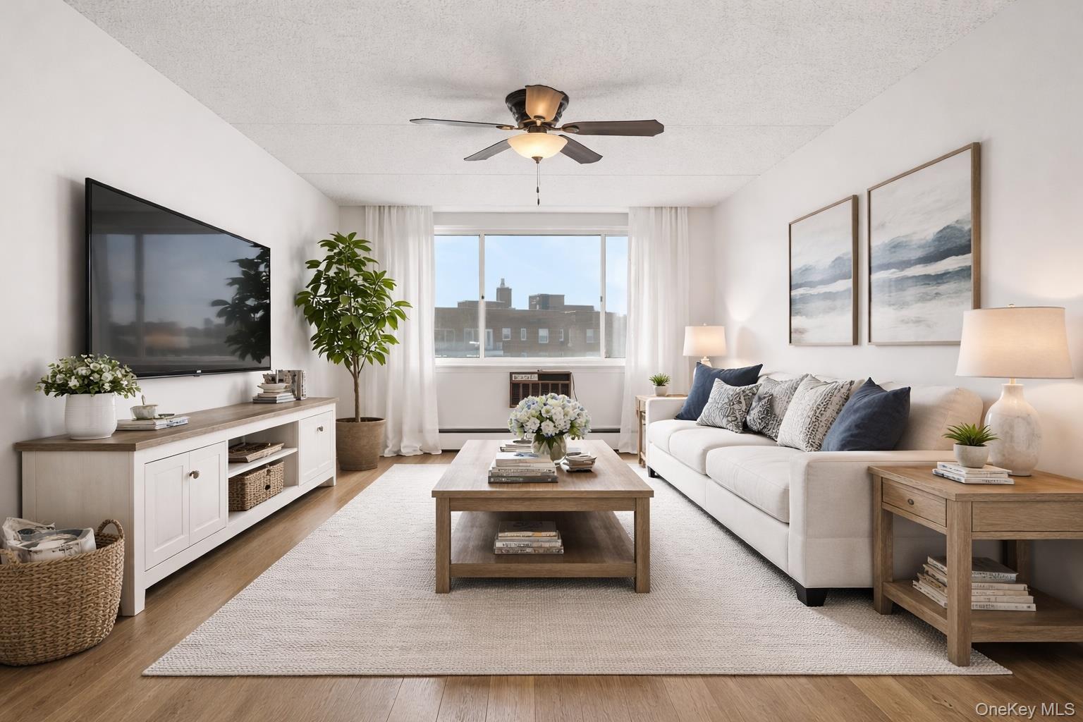 703 Pelham Road, Unit 412 New Rochelle, NY 10805 - Photo 7 of 26 Sunny and spacious Living Room with door to the covered balcony. Virtually staged.