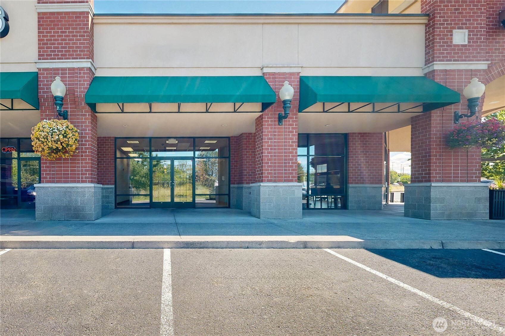 1605 Southeast Meadowbrook Street College Place, WA 99324 - Photo 1 of 30 a front view of a house with garden