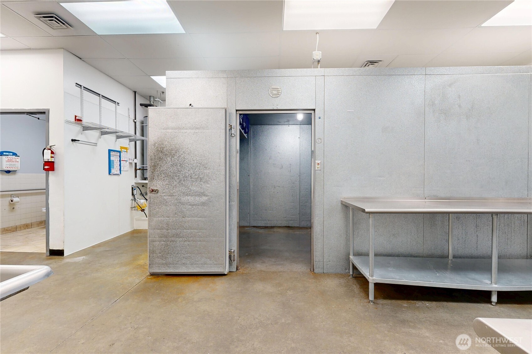 1605 Southeast Meadowbrook Street College Place, WA 99324 - Photo 11 of 30 a view of an empty room with cabinet and stairs