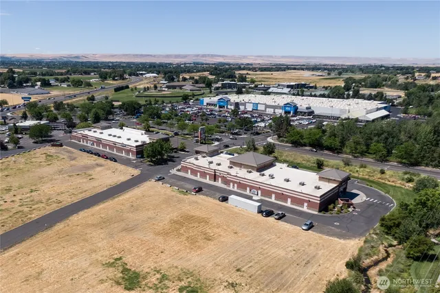 an aerial view of a house with a lake view