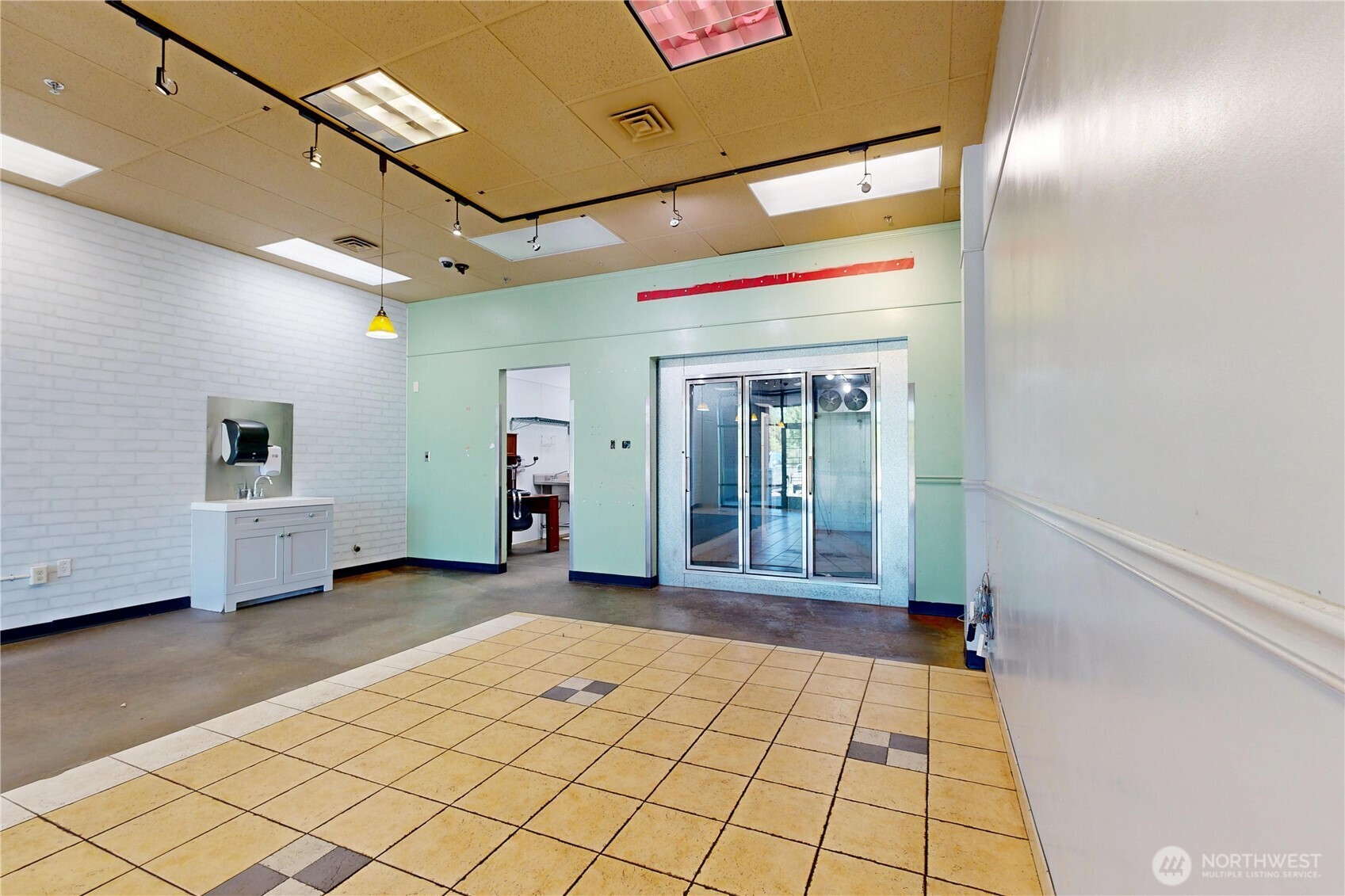 1605 Southeast Meadowbrook Street College Place, WA 99324 - Photo 4 of 30 a view of a hallway with wooden floor and table