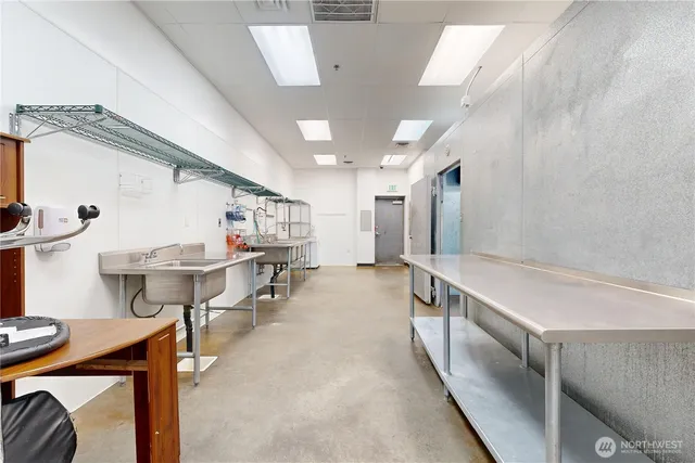 a view of a hallway with seating area