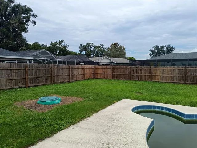 a view of a backyard with a garden and plants