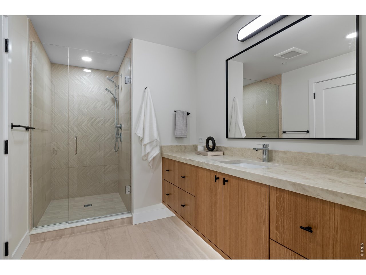 9578 Mountain Ridge Drive Boulder, CO 80302 - Photo 42 of 47 a bathroom with double sink and a mirror