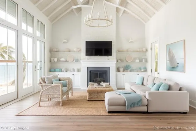 a living room with furniture fireplace and window