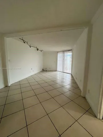 a view of a livingroom and window