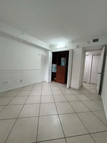 a view of a livingroom with an empty space and a sink