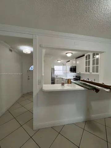 a view of a living room and chandelier