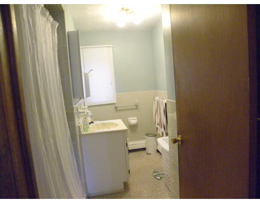22 Donna Road Chelmsford, MA 01824 - Photo 9 of 13 a bathroom with a sink a toilet and a mirror