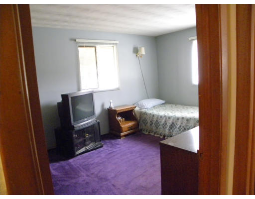 22 Donna Road Chelmsford, MA 01824 - Photo 10 of 13 a bedroom with a bed and a mirror