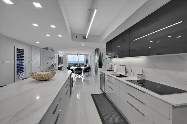 a kitchen with sink stove and cabinets