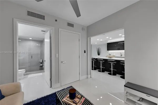 a spacious bathroom with a tub and mirror