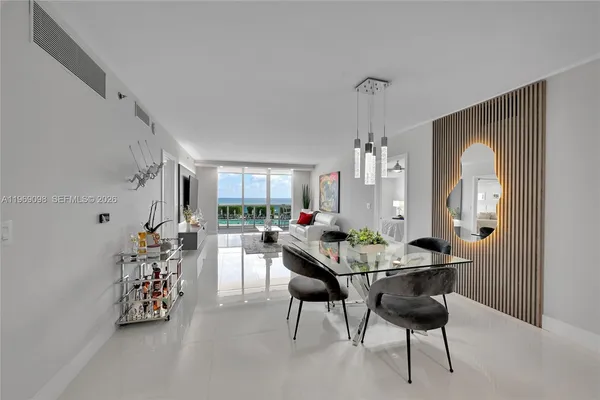 a dining room with furniture and window