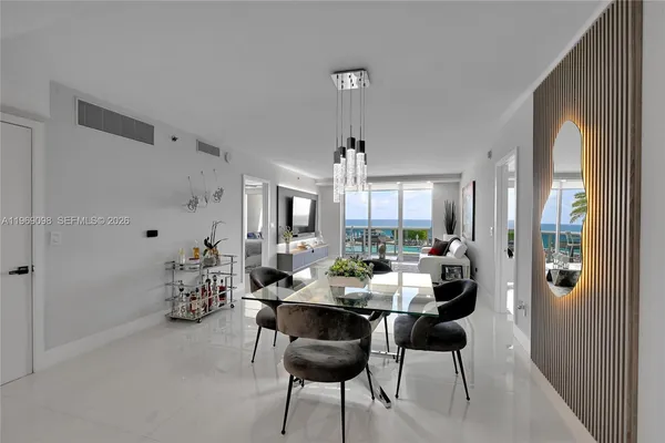 a dining room with furniture and window