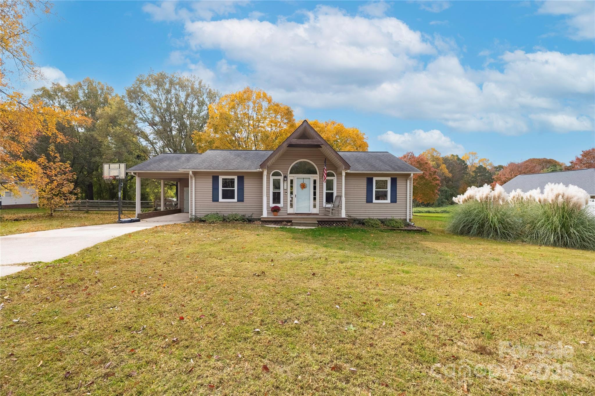 117 Clodfelter Road Mooresville, NC 28115 - Photo 2 of 39 a view of a large house with a big yard and large trees