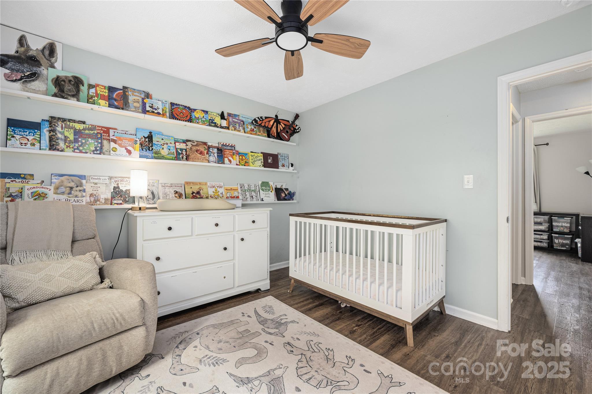117 Clodfelter Road Mooresville, NC 28115 - Photo 25 of 39 a bedroom with a bed and a book shelf