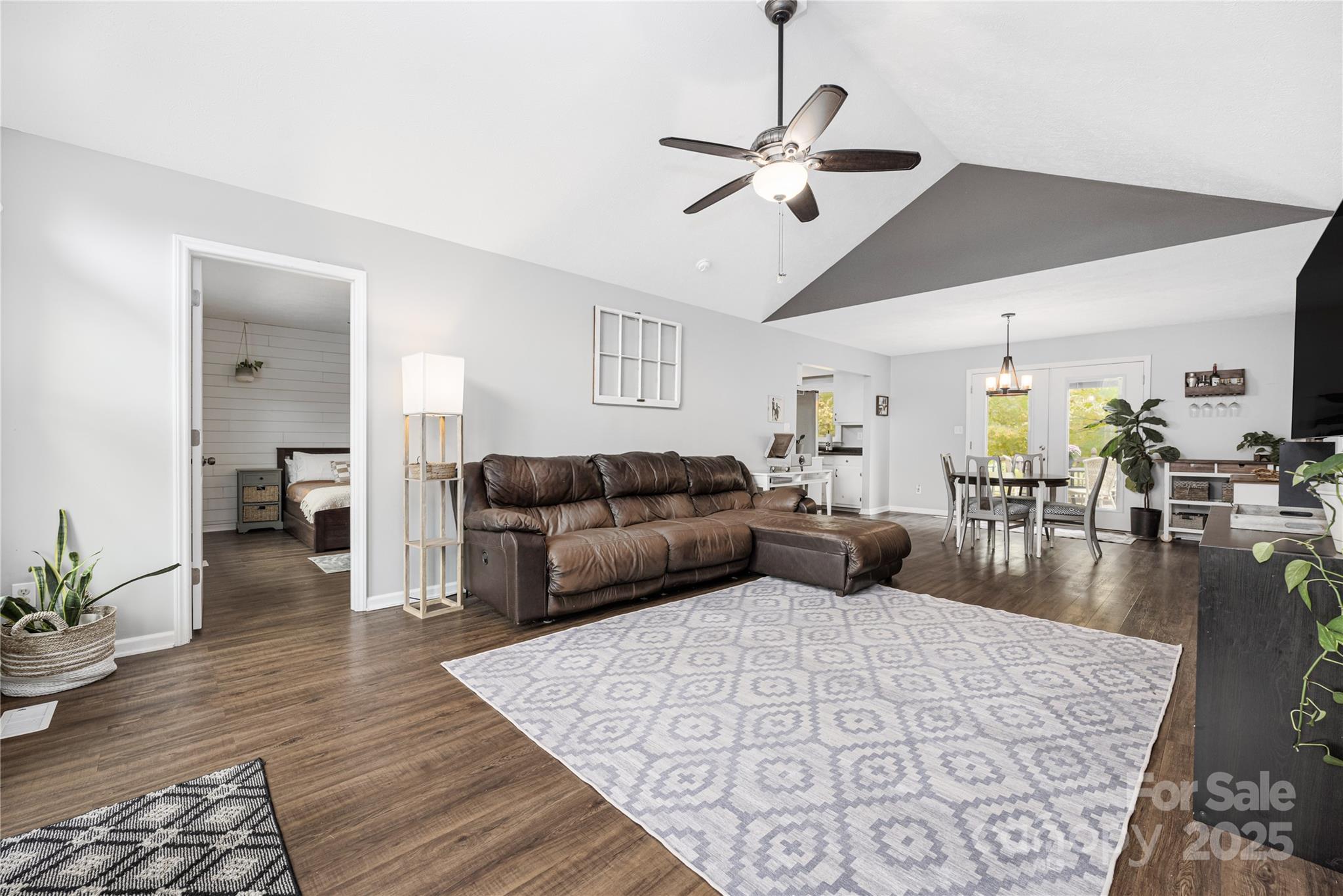 117 Clodfelter Road Mooresville, NC 28115 - Photo 7 of 39 a living room with furniture and a wooden floor