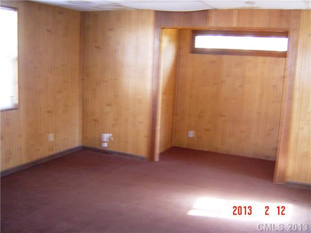 6212 Old Meadow Road Charlotte, NC 28227 - Photo 6 of 10 a view of an empty room with a window