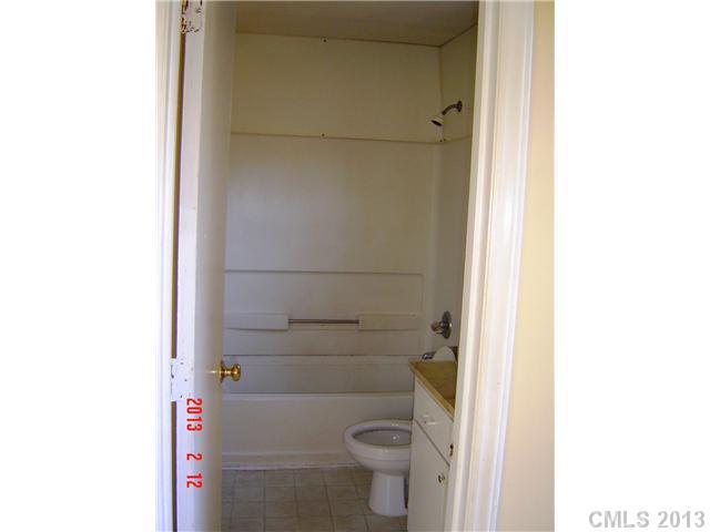 6212 Old Meadow Road Charlotte, NC 28227 - Photo 8 of 10 a bathroom with a toilet and a shower
