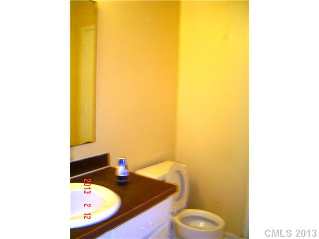 6212 Old Meadow Road Charlotte, NC 28227 - Photo 9 of 10 a bathroom with a sink and a mirror