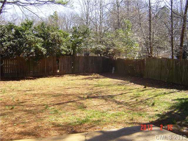 6212 Old Meadow Road Charlotte, NC 28227 - Photo 10 of 10 a swimming pool with wooden fence