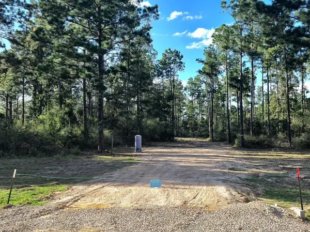 a view of a water fountain in the yard