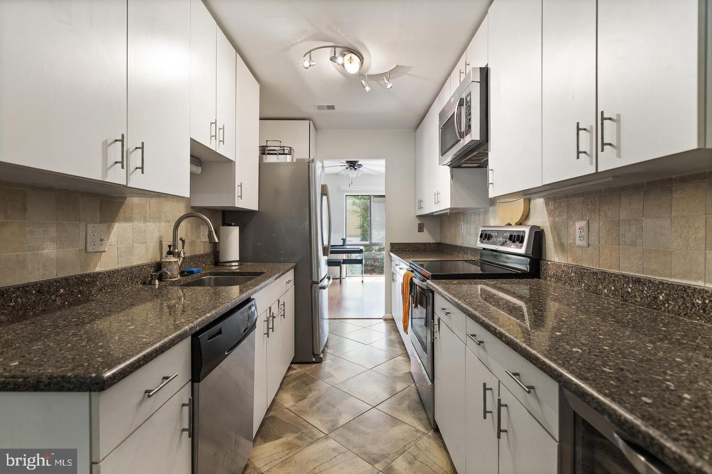 2343 Millennium Lane Reston, VA 20191 - Photo 11 of 34 Sleek modern kitchen with stylish finishes.