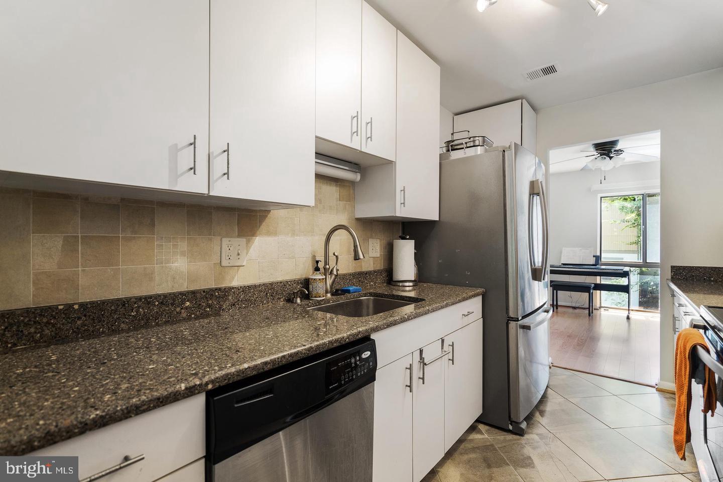 2343 Millennium Lane Reston, VA 20191 - Photo 13 of 34 Modern kitchen with sleek finishes.