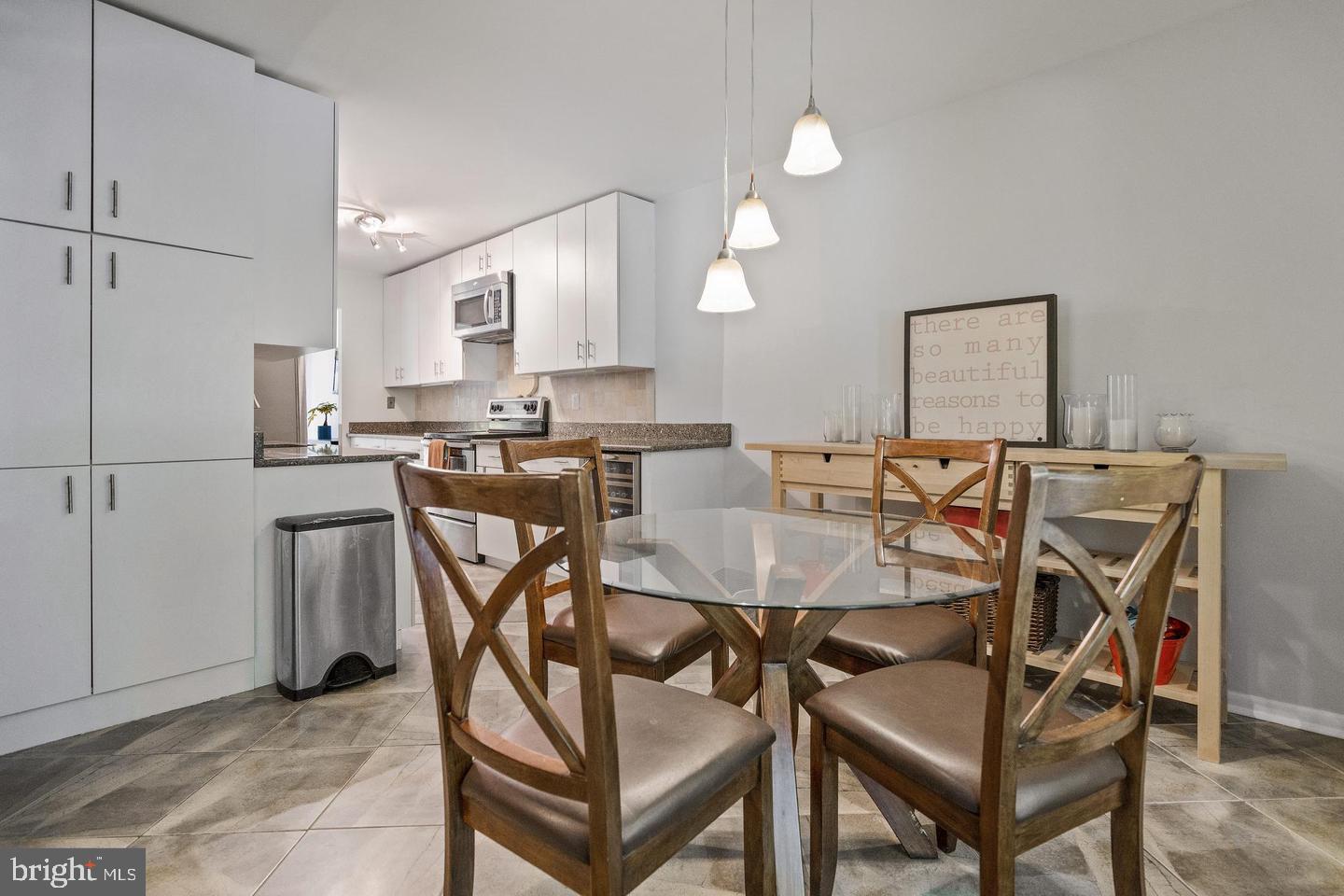 2343 Millennium Lane Reston, VA 20191 - Photo 15 of 34 Modern kitchen with stylish dining area.