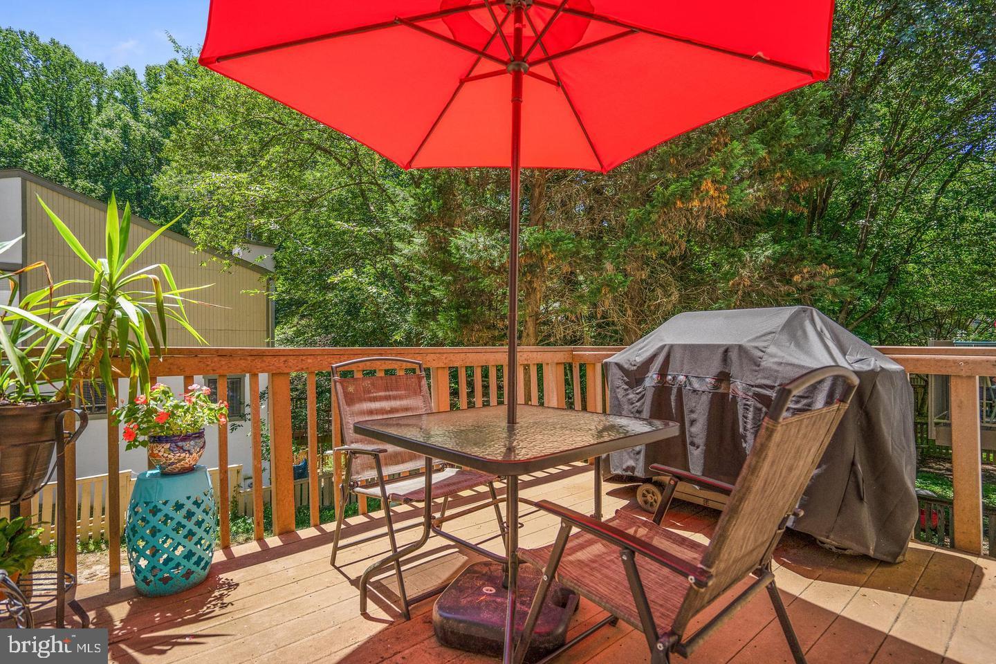 2343 Millennium Lane Reston, VA 20191 - Photo 7 of 34 Sunny deck with vibrant red umbrella.