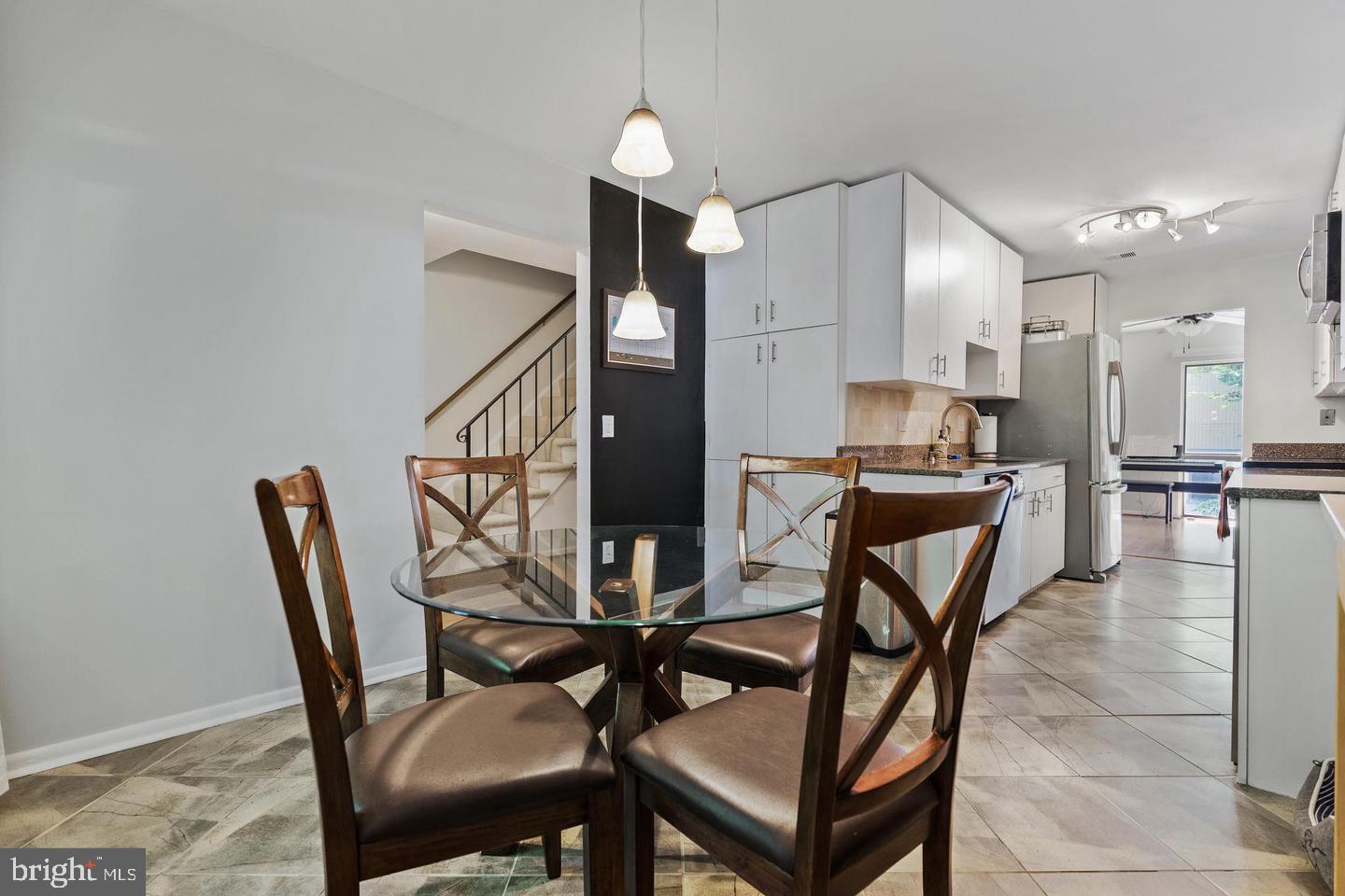 2343 Millennium Lane Reston, VA 20191 - Photo 9 of 34 Modern kitchen with inviting dining area.
