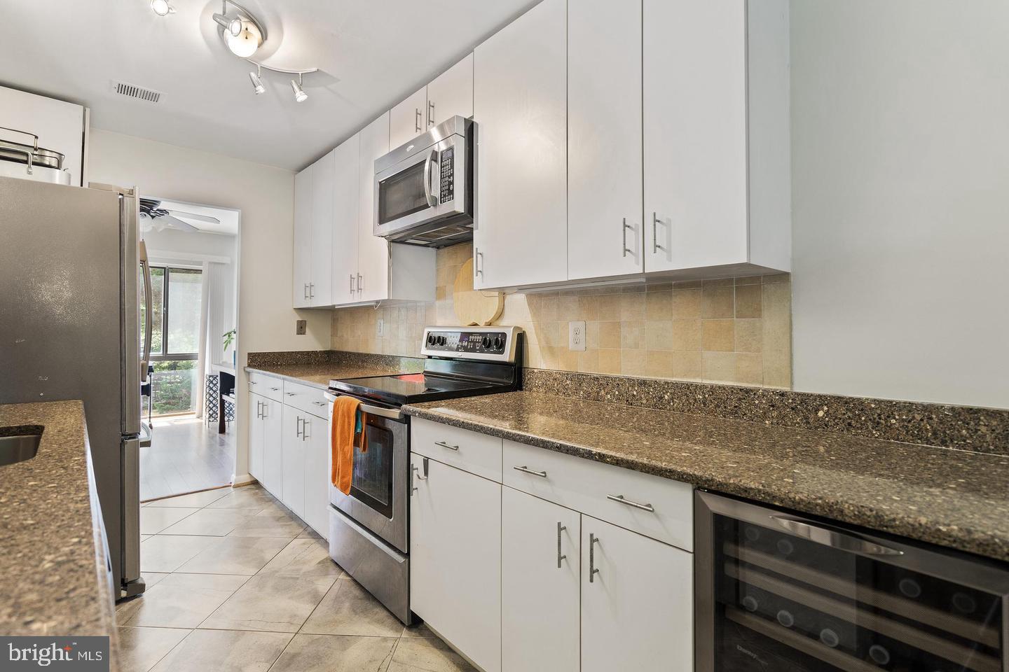 2343 Millennium Lane Reston, VA 20191 - Photo 10 of 34 Modern kitchen with sleek finishes.
