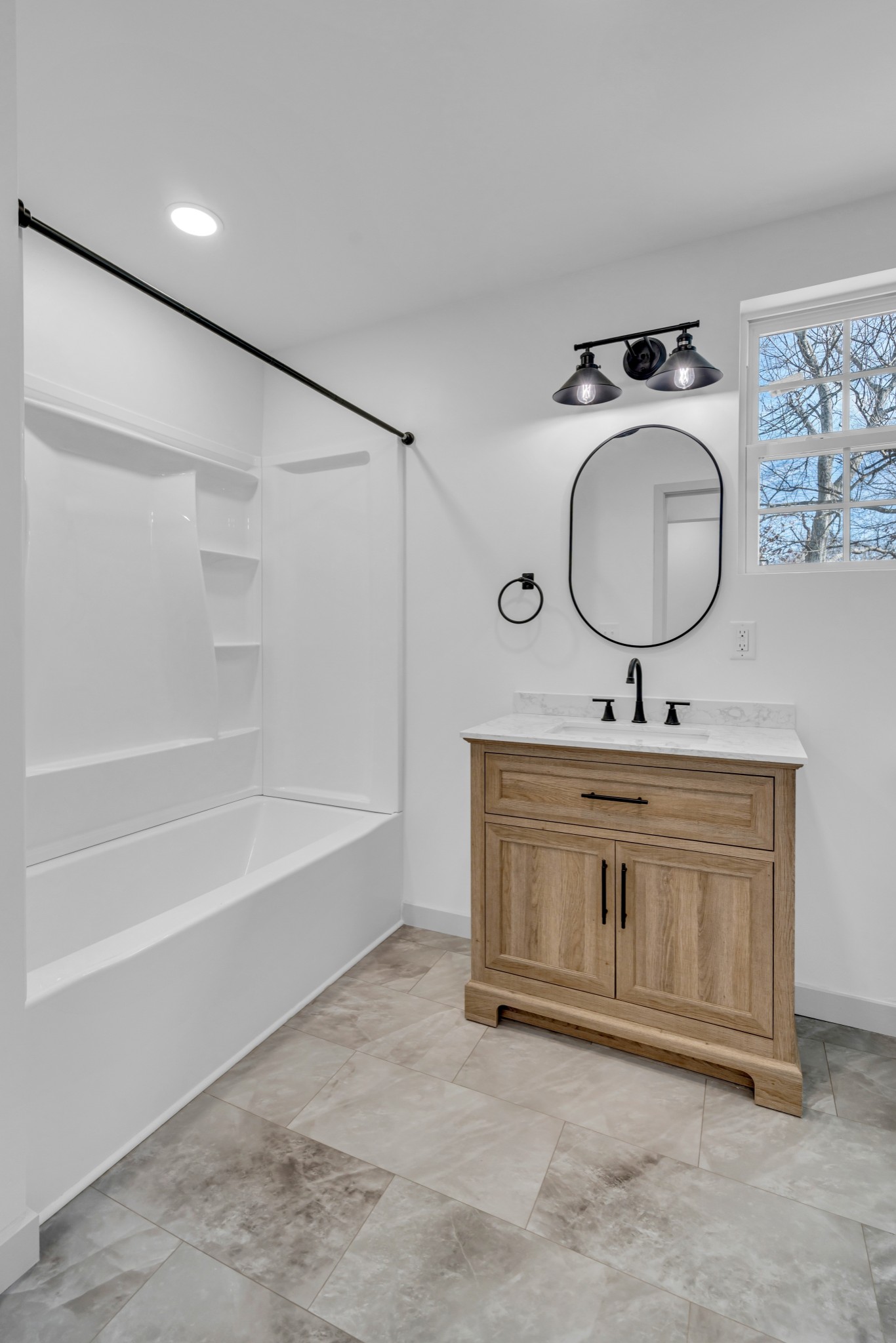 7159 C C C Road Fairview, TN 37062 - Photo 29 of 83 a bathroom with a granite countertop sink a mirror a vanity and a shower